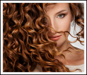 Woman with beautiful curly red hair